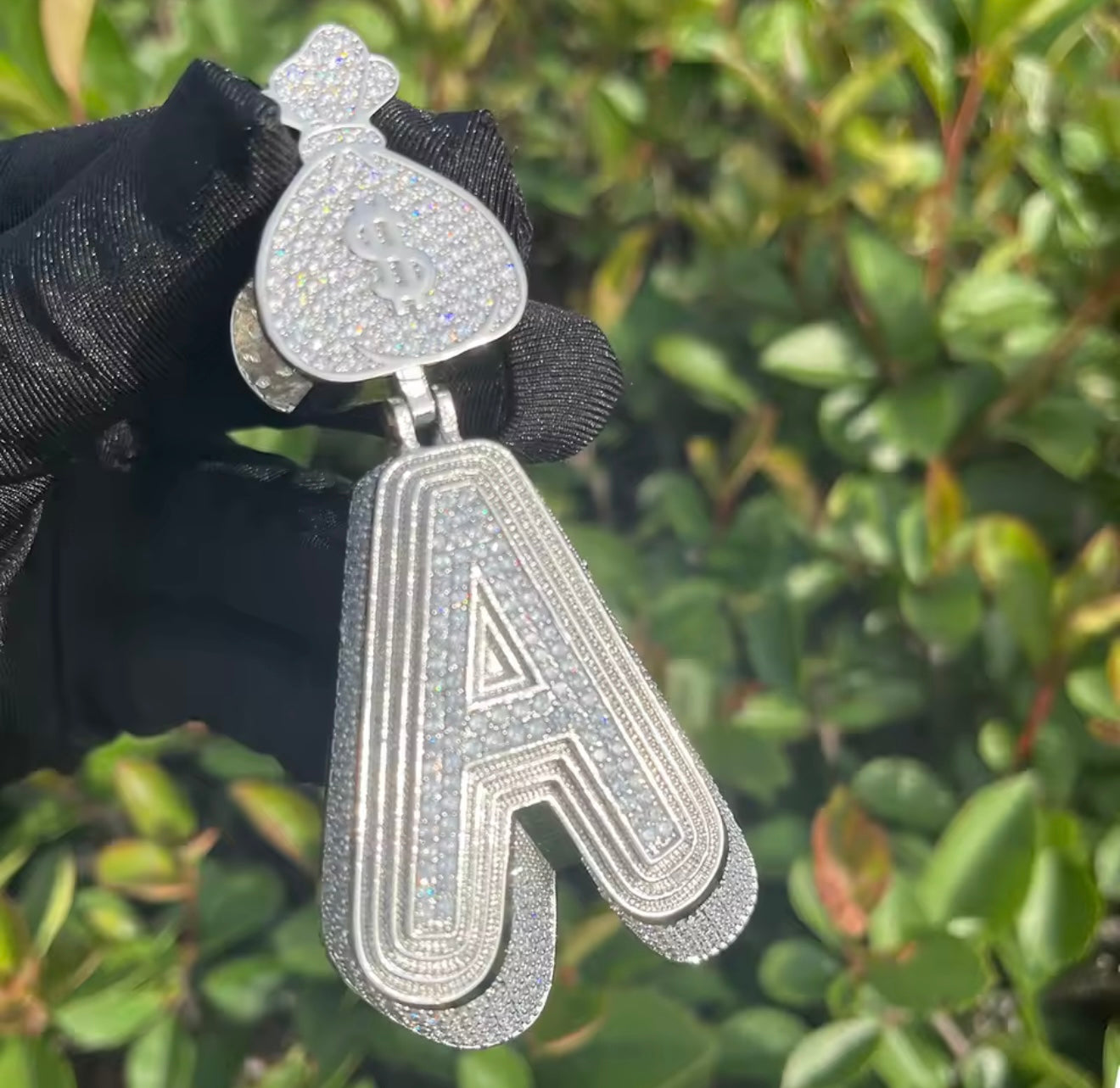 Money bag initial pendant worn on chain by Charmbox Men