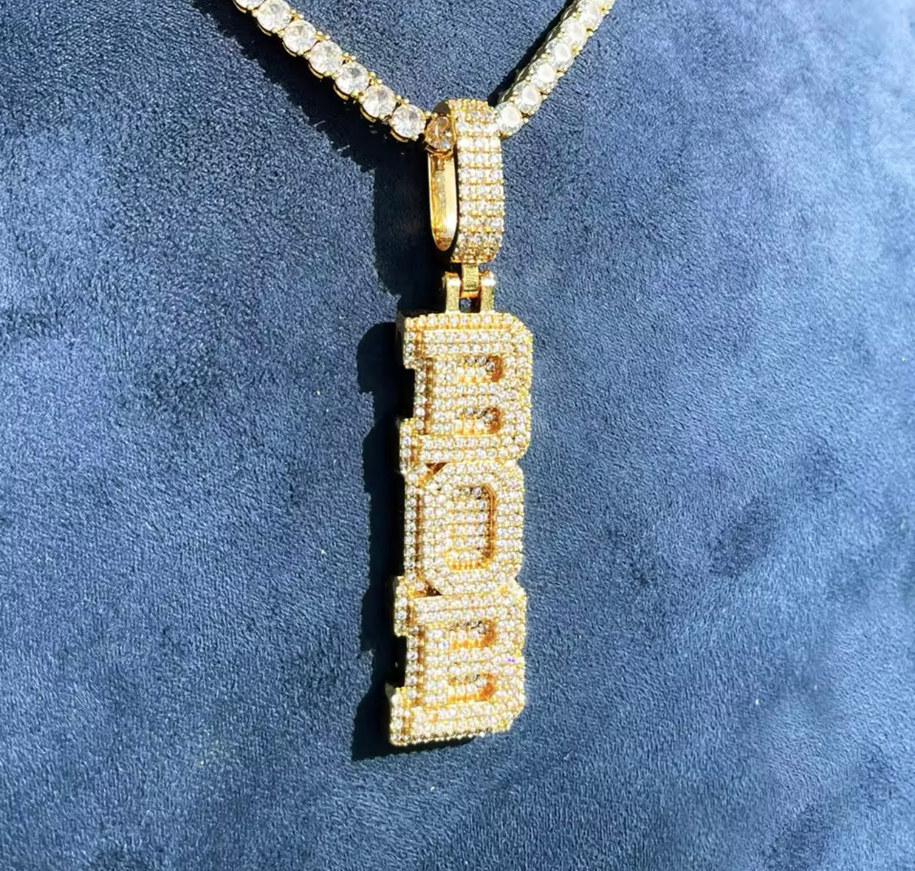 Trim custom pendant worn on chain by Charmbox Men